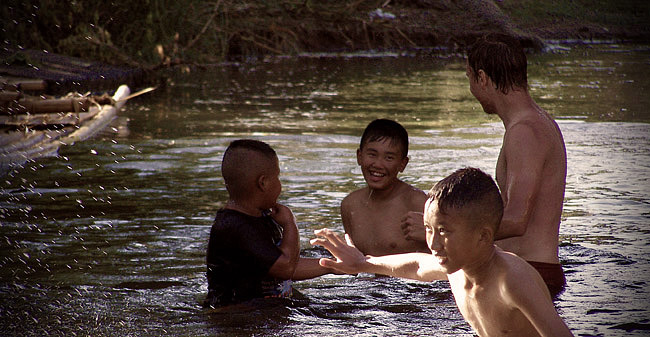 Thai kids in the river